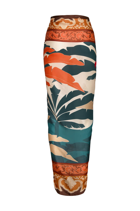 De La Falaise cotton silk sarong in Peach Dancer with a tropical palm and floral border print.