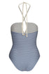 A navy and ivory striped one-piece swimsuit with a teardrop cutout and braided halter ties.