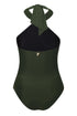 Reversible green and black one-piece swimsuit with a braided halter neck and gold charm detail.