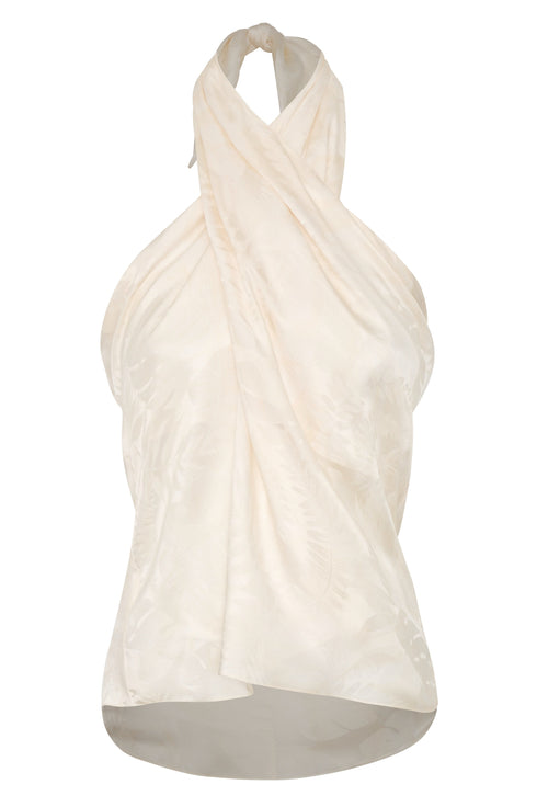 Ivory silk jacquard halter blouse with a draped, wrap-style front and rainforest pattern.