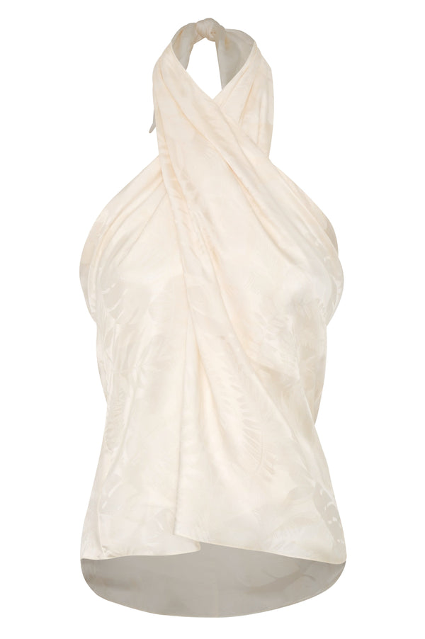 Ivory silk jacquard halter blouse with a draped, wrap-style front and rainforest pattern.